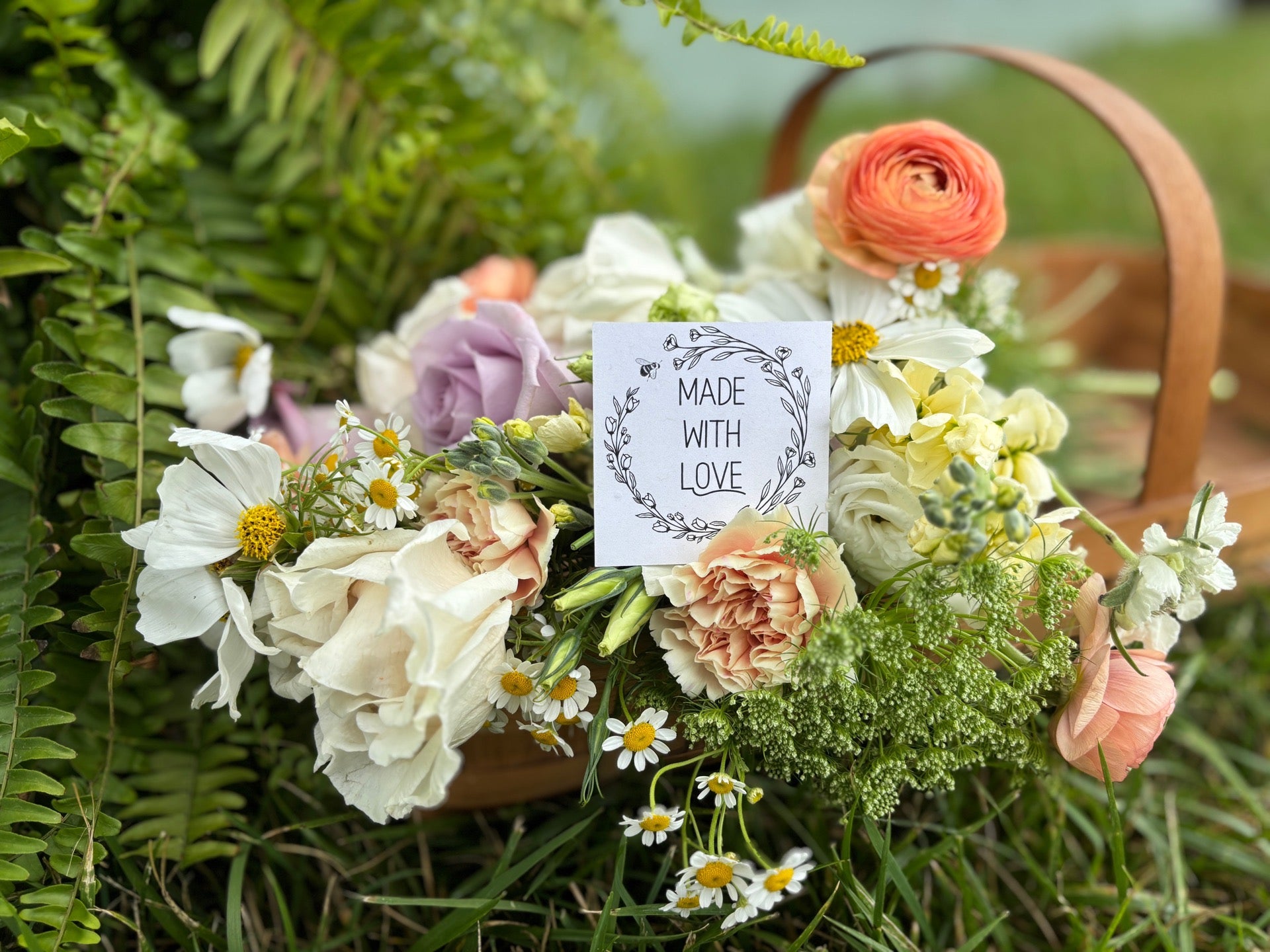 Basket of fresh flowers arranged by Bumble & Bloom